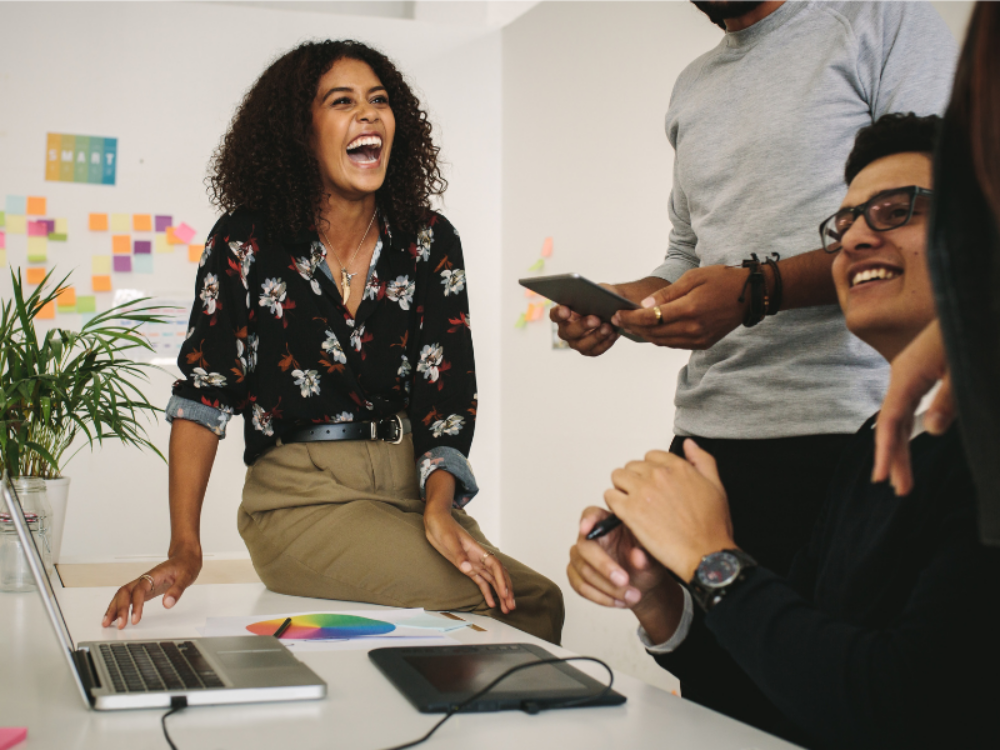 Colleagues laughing at work